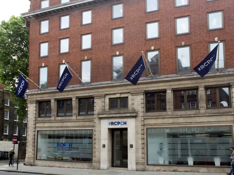 College building from the street, with RCPCH flags College building from the street, with RCPCH flags