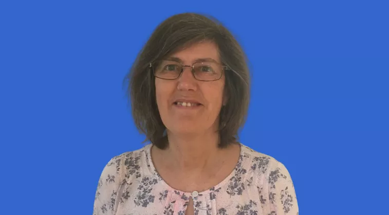 Rosamund Jones Photo of Rosamund Jones: woman smiling with flower top